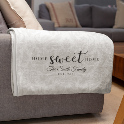 blanket over couch with personalized text saying Home Sweet Home, The Smith Family